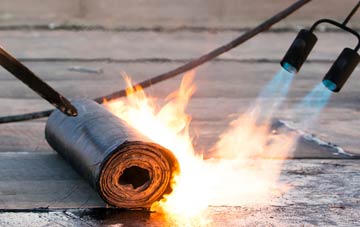 Crew Lower asphalt flat roofing repairs